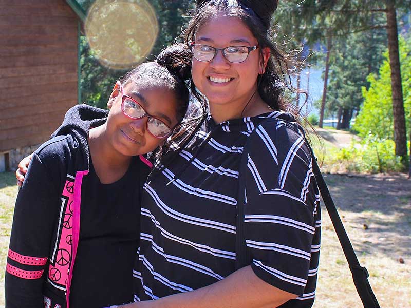 Two campers smile for camera